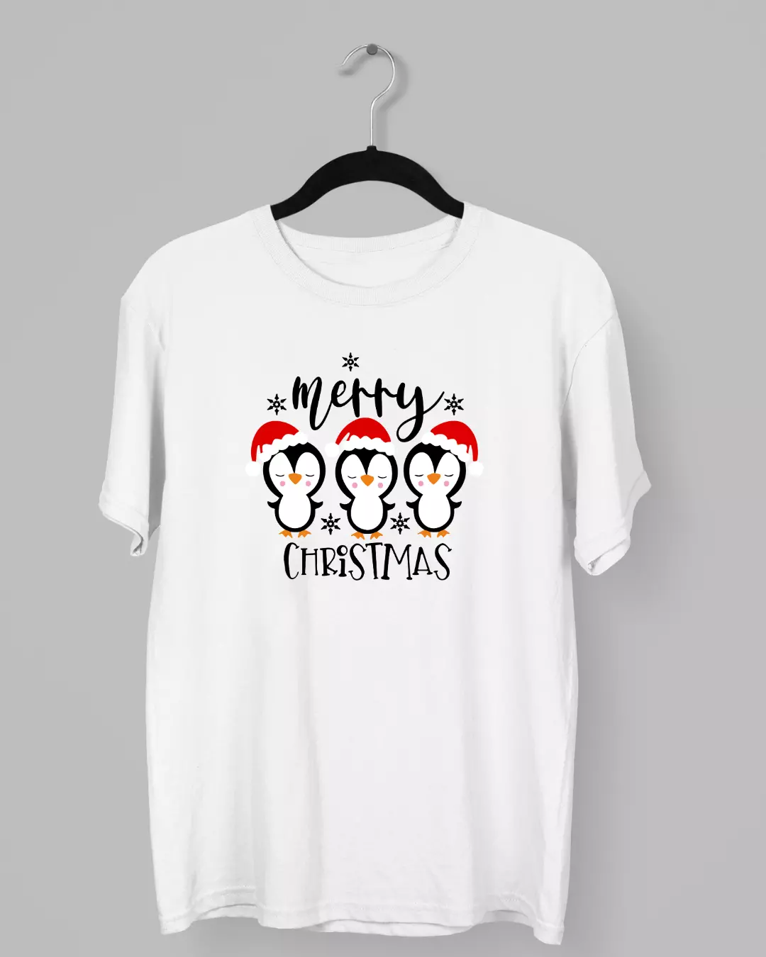 Remera de tres pingüinitos con gorras navideñas
